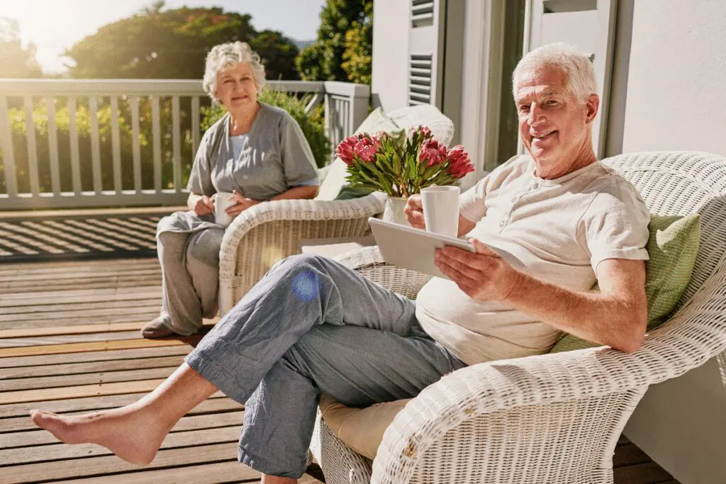 Retired couple enjoying coffee after meeting with their fiduciary financial planner